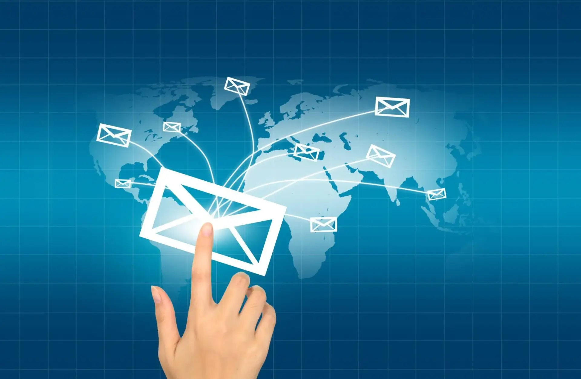 Digital illustration of a hand pressing on a virtual envelope with global email distribution routes on a world map, symbolizing Bnternet's email marketing reach